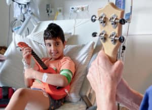 boy with instrument - music therapy